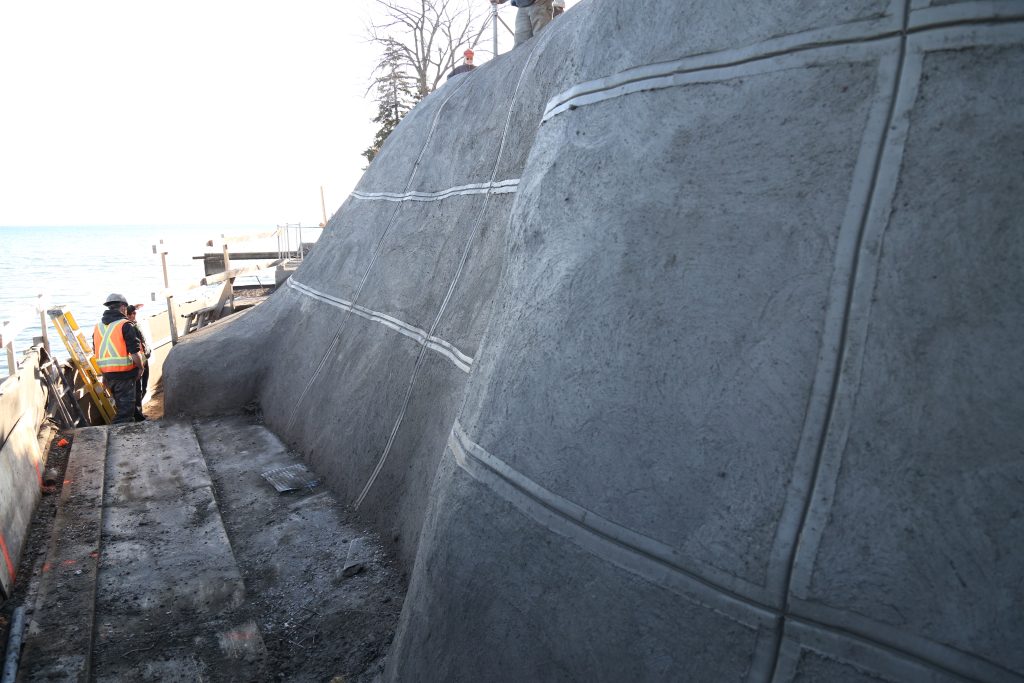 The utility of structural shotcrete as a concreting option with an applied architectural finish is shown below at a job that HC Matcon completed along a residential shoreline.