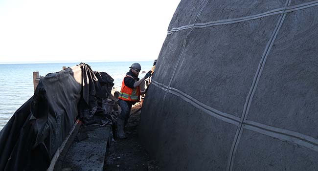 The utility of structural shotcrete as a concreting option with an applied architectural finish is shown below at a job that HC Matcon completed along a residential shoreline.